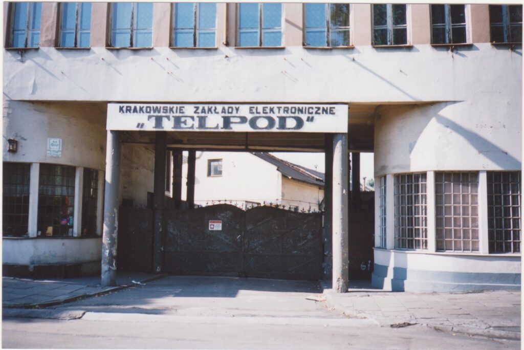 Entrance to Oskar Schindler’s Factory in Kraków photographed in July 2000, with the TELPOD sign still visible above the door.